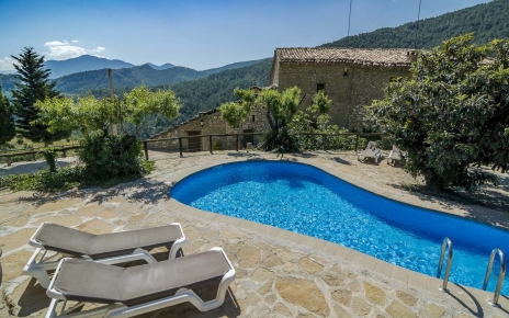 The pool area is next to the villa